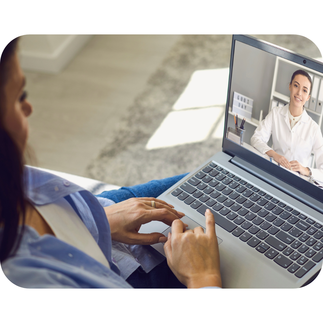 A patient talking to her doctor using her laptop